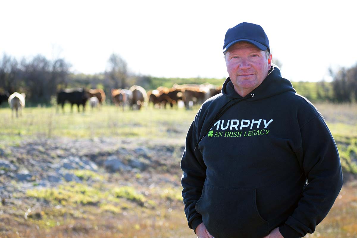 photo shows cattleman Sean Murphy on his farm near Souris MB (photo DUC)