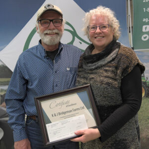 Kevin and Julie Bridgeman accepting award for Top 5 Forage Establishment from Ducks Unlimited Canada.