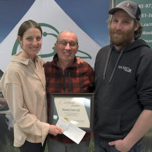 Anna, Mark and Hadyn Donohoe accepting award for Top 5 Forage Establishment from Ducks Unlimited Canada.