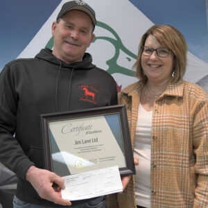Dave and Tina Collier accepting award for Top 5 Forage Establishment from Ducks Unlimited Canada.